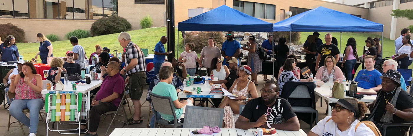 People celebrating Juneteenth at the Waterfall Courtyard on the John A. Logan College Campus.