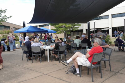 Students, faculty, and staff in the JALC courtyard.