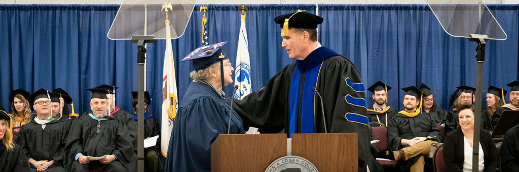 Student speaker Betty Adams with College President Dr. Kirk Overstreet at Commencement ceremony for John A. Logan College.