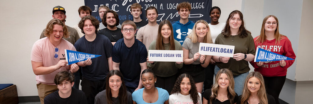 High schools students posing together and holding signs at New Student Orientation Day at John A. Logan College.